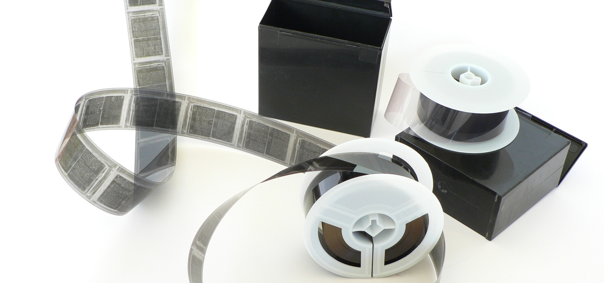 Rolls of Microfilm And Their Packaging, Waiting To Be Scanned