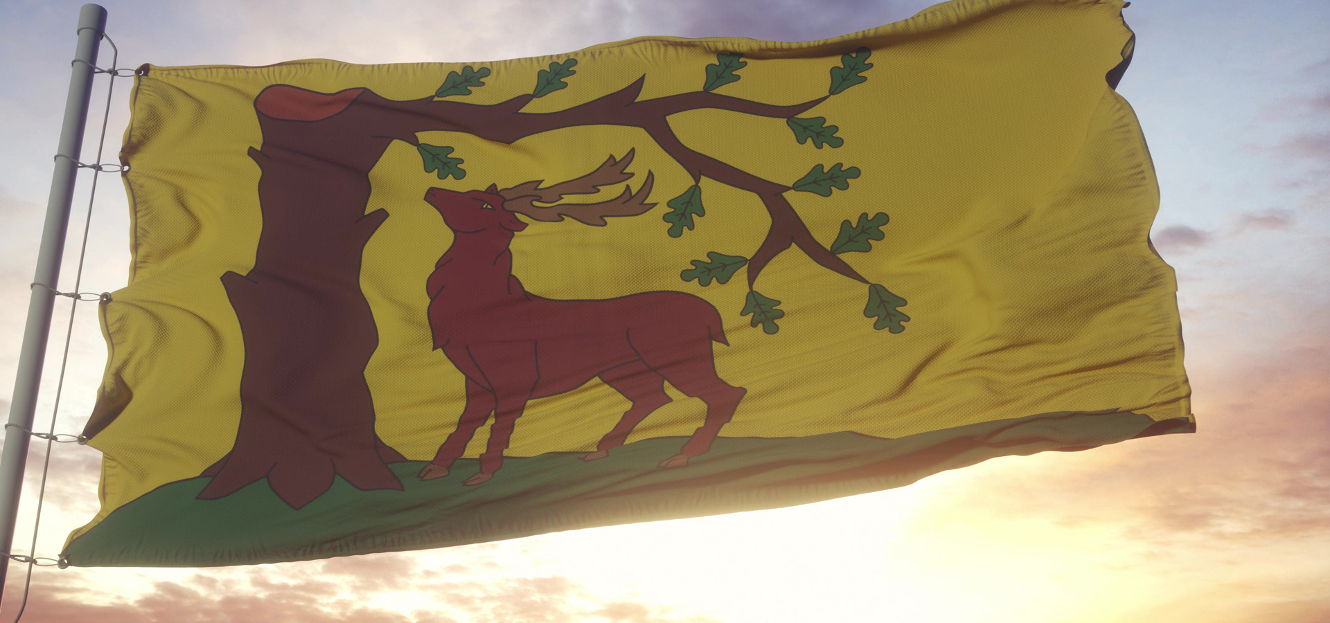 Berkshire Flag Flying In Front Of A Bright Sunrise
