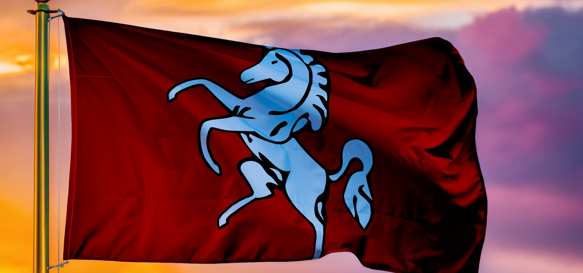 Kent Flag Fluttering In The Breeze In Front Of A Sunrise